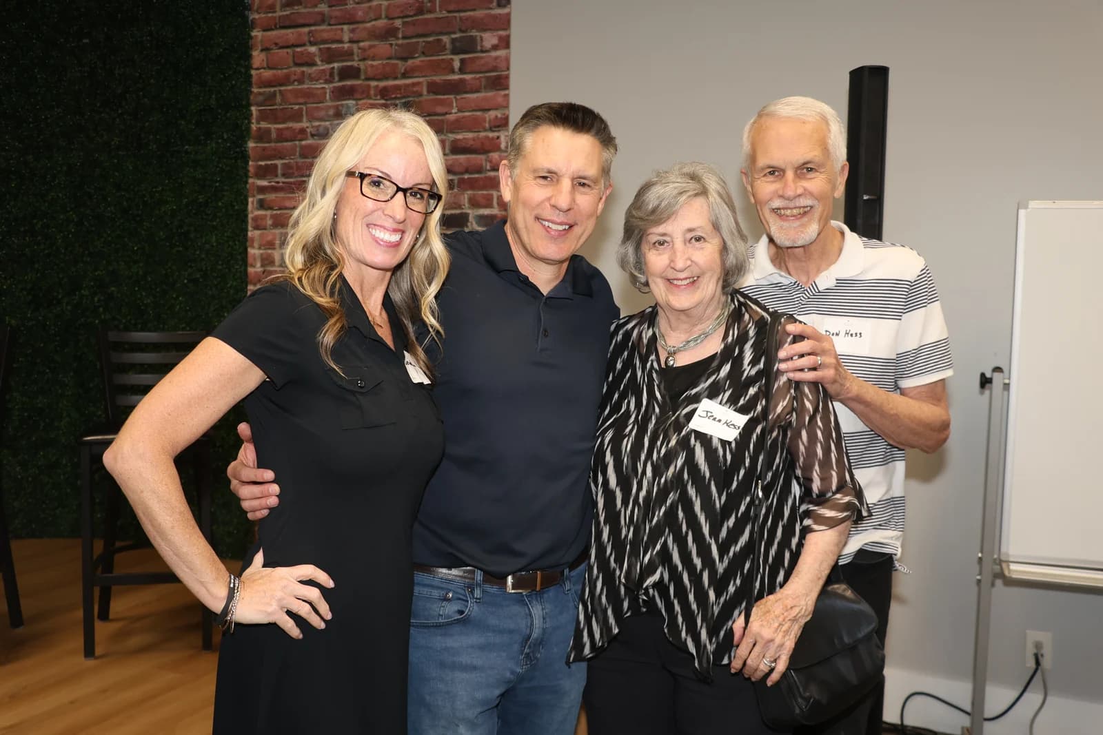 Four guests smiling together at a New Life Networking event
