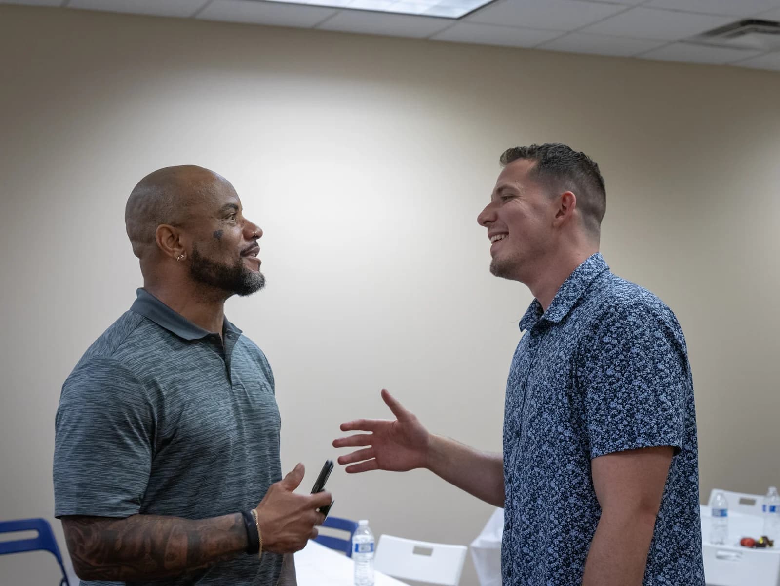 Two guests smiling in conversation at New Life Networking